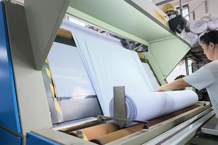 Fabric Inspection & Quality Control Fabric inspection machine checking width, weight and surface defects for knit fabric rolls